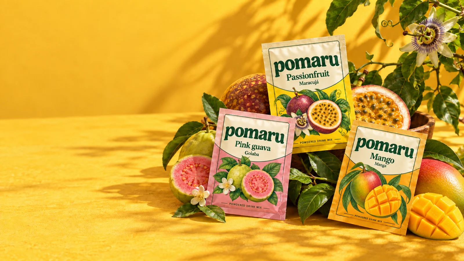 POMARU passionfruit, pink guava and mango sachet concepts with fruit in warm sunlight
